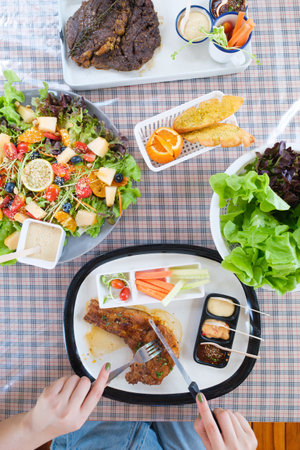 young women eating healthy food in restaurantsの写真素材