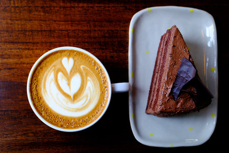 hot mocha with chocolate cake on the tableの写真素材