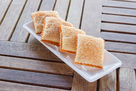 Crackers butter sugar four piece on saucer, stock photo