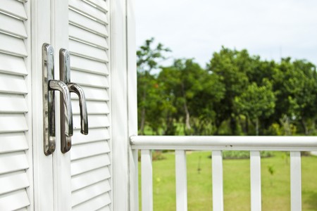 Close white door in gardenの写真素材