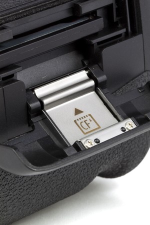 Closeup compact flash memory card slot on DSLR camera