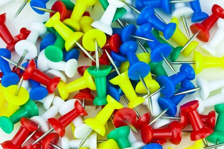 a lot of colorful push pins