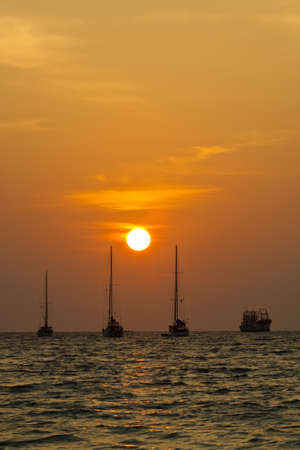 Sailing boat silhouette on a background of a beautiful sunset.