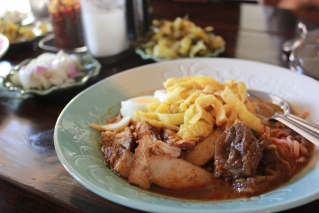 Thai Northern style curry soup with noodle and braised pork, Khao Soiの写真素材