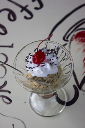 The sundae is a sweet ice cream dessert  It typically consists of one or more scoops of ice cream topped with sauce or syrup, and in some cases other toppings including sprinkles, whipped cream, maraschino cherries, or other fruits  e g , bananas and pineの写真素材