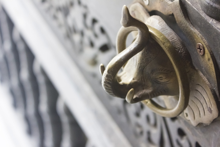Ancient lanna door, Elephant door locked of Wat Phra Daraphirom, Chiang Mai Thailandの写真素材