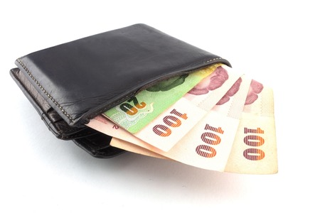 Black wallet with money isolated  on white background の写真素材