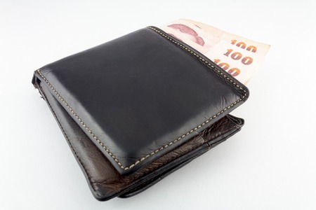 Black wallet with money isolated  on white background の写真素材