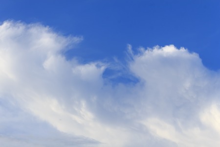 Blue sky with tiny clouds の写真素材
