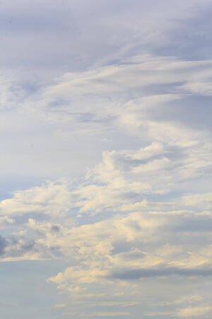 Blue sky with tiny clouds.の写真素材
