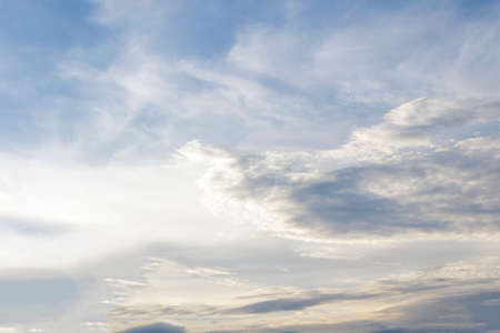 Blue sky with tiny clouds.の写真素材
