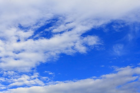 Blue sky background with tiny clouds.の写真素材