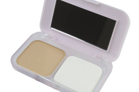 Powder, Puff and Powder-cases with a mirror on a white background.の写真素材