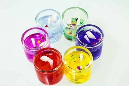 Beautiful colorful sweet scent candles on white background.の写真素材