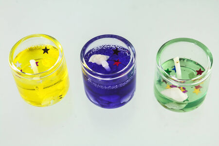 Beautiful colorful sweet scent candles on white background.の写真素材