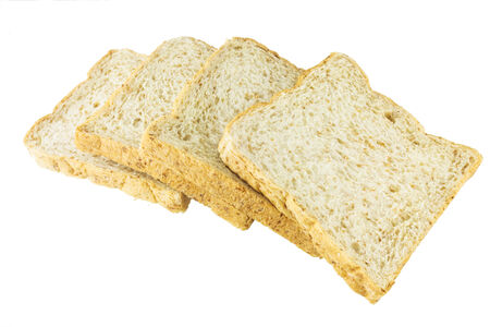 Closeup pile of sliced bread on white background.の写真素材