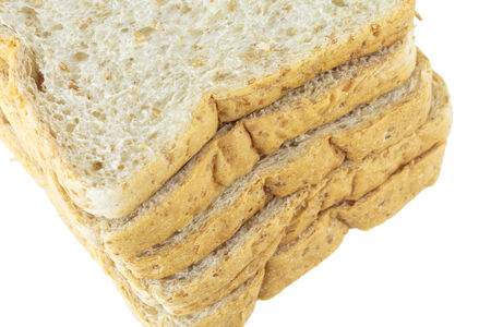 Closeup pile of sliced bread on white background.