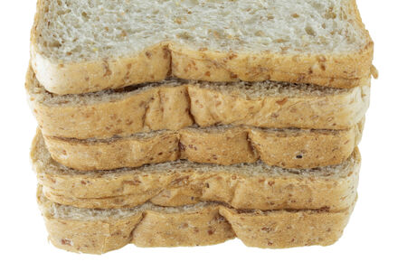 Closeup pile of sliced bread on white background.の写真素材
