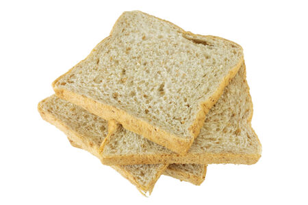 Closeup pile of sliced bread on white background.の写真素材