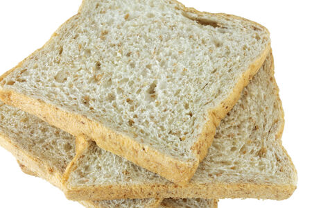 Closeup pile of sliced bread on white background.の写真素材