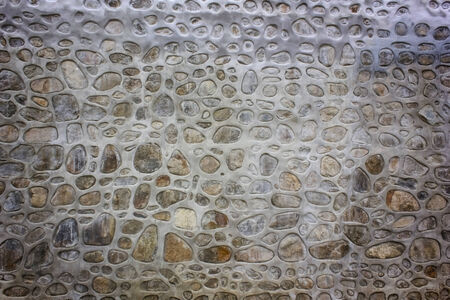 Stone wall background, Textured cobbled wall background with stones and cement.の写真素材
