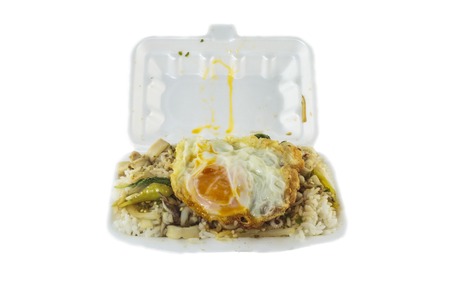 Thai food,rice with fried egg on top.Santed pork with chili & Basil leaves.