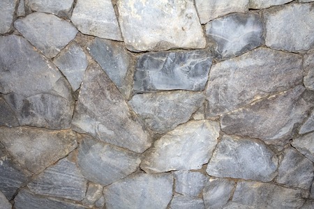 Stone wall background, Textured cobbled wall background with stones and cement.の写真素材