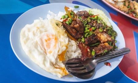 Thai food,rice with fried egg on top.Santed pork with chili & Basil leaves.の写真素材