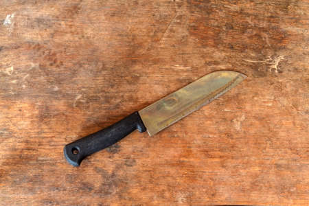 Knife, Knife on wooden background in rustic kitchen.