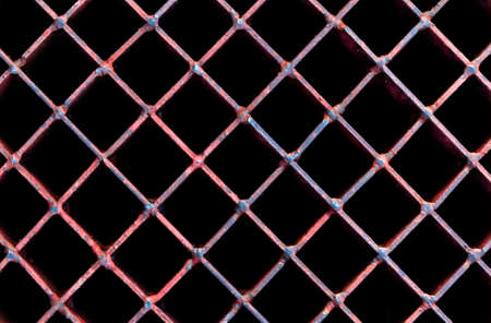 Old rusty lattice, A metal grate with a rusty texture.の写真素材