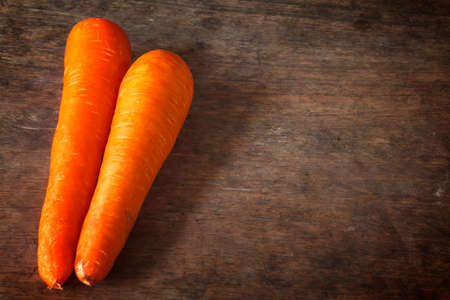 Carrots, Orange carrots on a wooden background.の写真素材