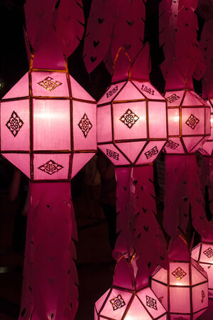 Closeup Group of burning candles in thai style.の写真素材