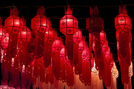 Closeup Group of burning candles in thai style.の写真素材