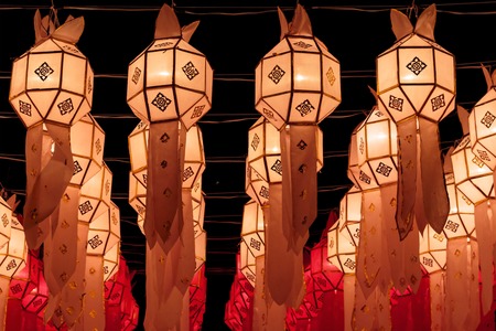 Closeup Group of burning candles in thai style.の写真素材