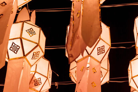 Closeup Group of burning candles in thai style.の写真素材