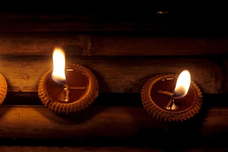 Closeup Group of burning candles in thai style.の写真素材