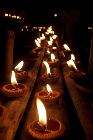 Closeup Group of burning candles in thai style.の写真素材