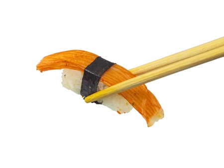Sushi with chopsticks isolated over white の写真素材