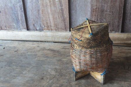 Thai bamboo sticky rice. Thai bamboo sticky rice container on wooden background.の写真素材