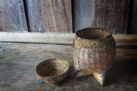 Thai bamboo sticky rice. Thai bamboo sticky rice container on wooden background.の写真素材