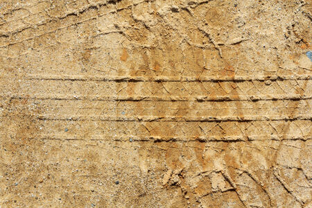 Closeup tire track on the ground. Tire truck print on the groundの写真素材