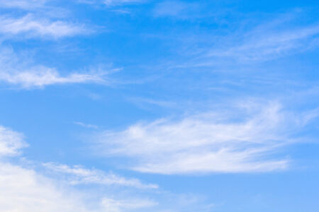 Blue sky background with tiny white cloud.の写真素材