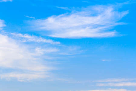 Blue sky background with tiny white cloud.の写真素材