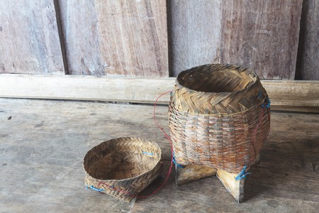 Thai bamboo sticky rice. Thai bamboo sticky rice container on wooden background.の写真素材