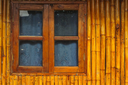 Wooden bamboo window on bamboo background. Wooden Windowの写真素材