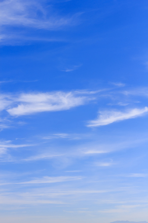 Blue sky background with tiny white cloud.の写真素材