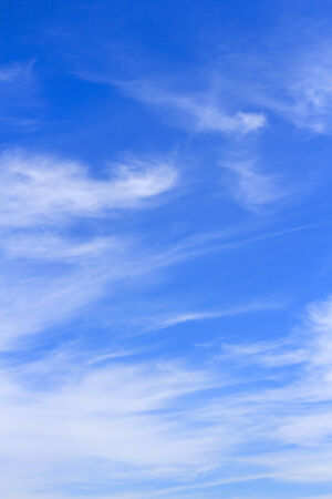 Blue sky background with tiny white cloud.の写真素材