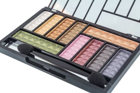 Colorful eye shadows palette with makeup brush  isolated on white background.の写真素材