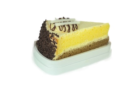 Piece of chocolate cake with cherry on white background.の写真素材