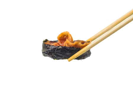Sushi with chopsticks isolated over white backgroundの写真素材